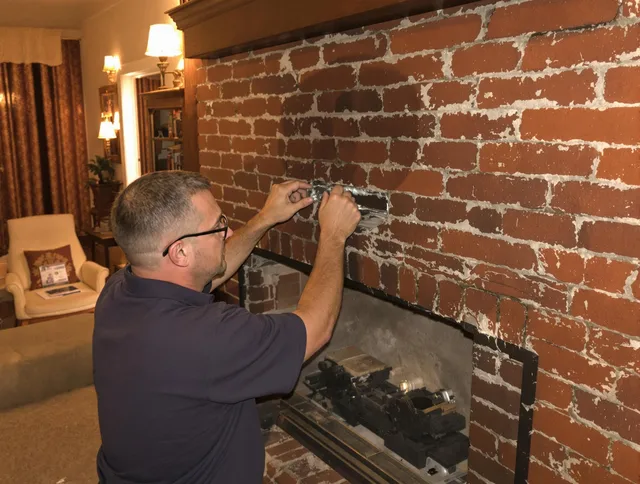 Jurupa Valley Chimney Sweep expert fixing a fireplace in Jurupa Valley, CA